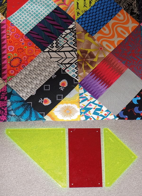 Kaniva Templates With Portionof A Scrappy Pieced Quilt